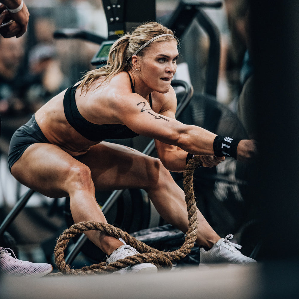 Crossfit athlete Katrin Davidsdottir participating in the CrossFit Games wearing athletic apparel pulls a rope
