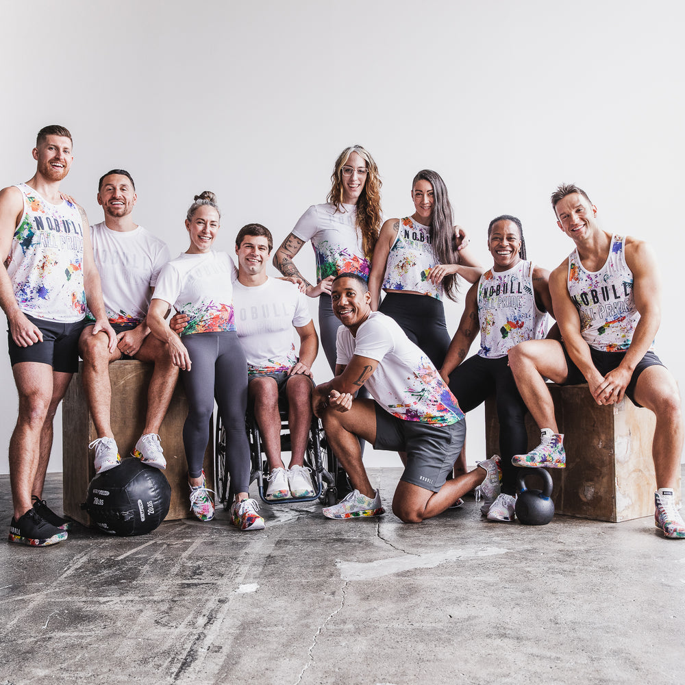 A group of athetes wearing tie-dyed rainbow athletic clothes from the All Pride collection